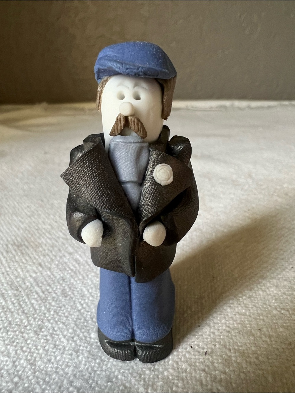 Handmade Clay Fisherman Figurine in Blue and Black